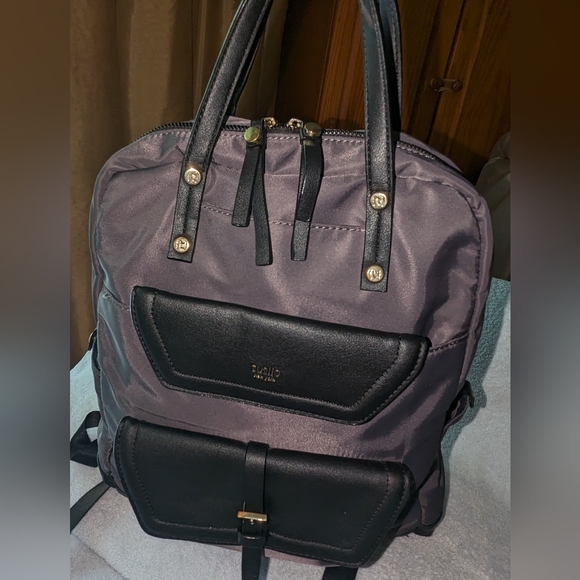 Tutilo charcoal gray with black trim backpack.